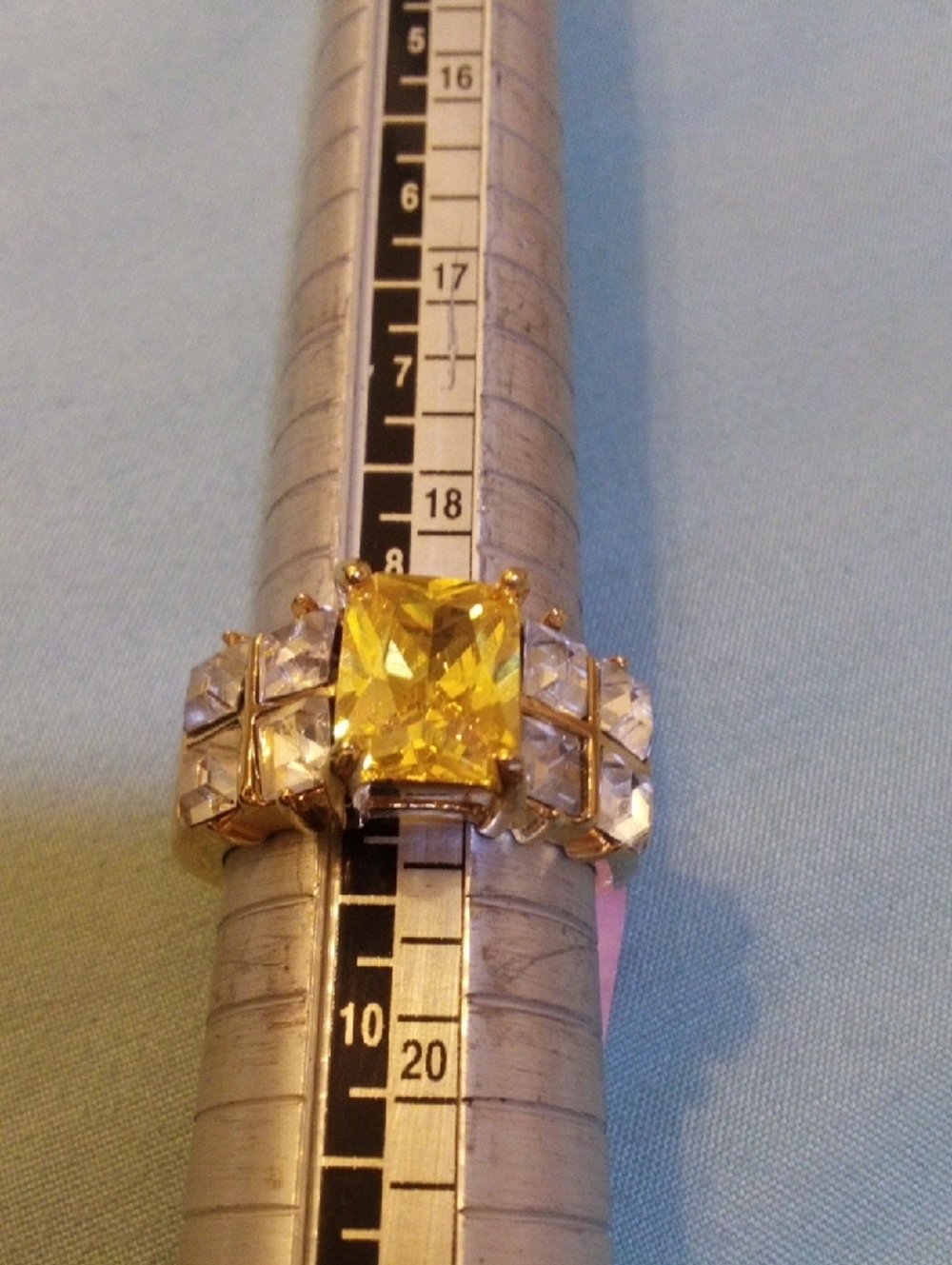 Gold-Tone Ring with Yellow Center Stone and Clear Accents